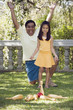 Indian father and daughter playing lawn bowling