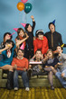 Group of young adults having birthday party