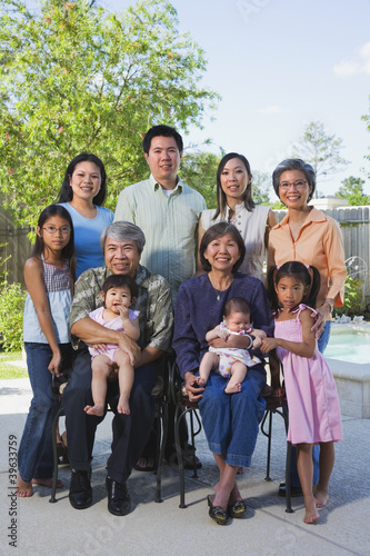 Photo: Multi-generational Asian family smiling outdoors Multi-generational Asian family smiling outdoors
