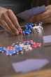 Close up of poker table with man's hands