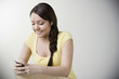 Hispanic woman listening to mp3 player
