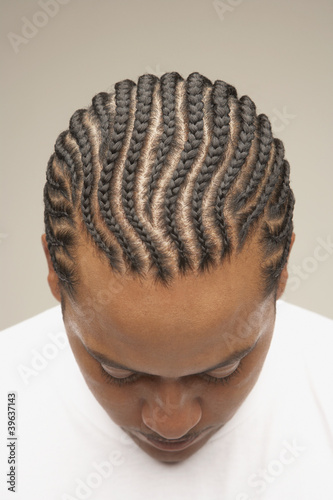 Photo: High angle view of African man with braids High angle view of African man with braids