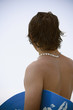 Hispanic man holding wake board