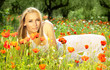 Beautiful female laying on the flower field Beautiful female laying on the flower field