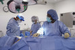 Doctors preparing patient in operating room