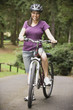 Portrait of Hispanic woman on bicycle