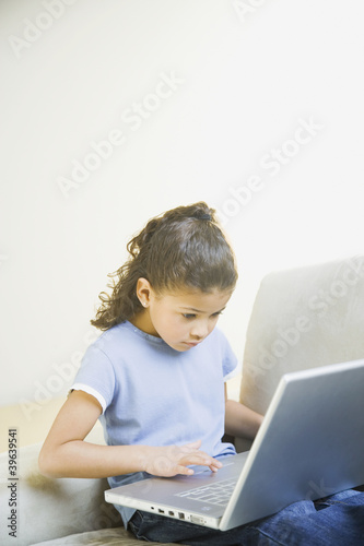 Photo: African girl typing on laptop African girl typing on laptop