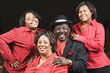 Portrait of African family wearing matching clothing