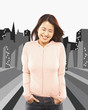 Asian woman laughing with hands in pockets