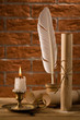 candle with antique writing accessries