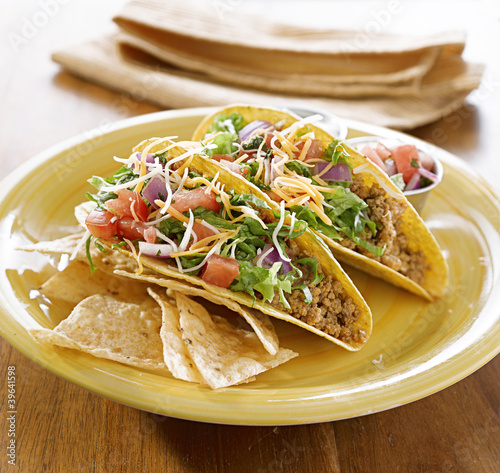 Photo: Tacos on a platter with tortillas - mexican food Tacos on a platter with tortillas - mexican food