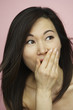 Asian woman looking surprised