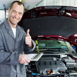 Master mechanic is proud and shows thumb up for good service