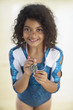 Young female gymnast wearing medal