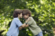 Two brothers playing outdoors