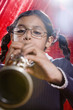 Hispanic girl playing clarinet