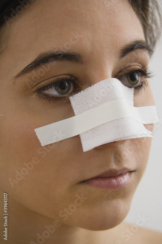 Photo: Native American woman with bandage on nose Native American woman with bandage on nose