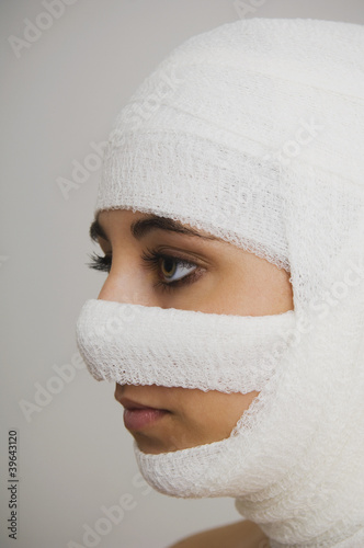 Photo: Native American woman with bandages around head Native American woman with bandages around head