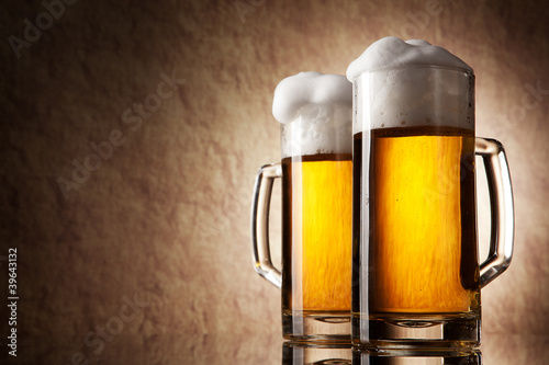 Photo: Beer into glass on a old stone Beer into glass on a old stone