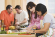 Group of middle-aged friends cooking