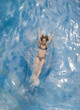 Woman splashing into water