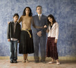 Portrait of Hispanic family with ghosted image of father