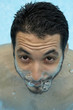 Hispanic man in swimming pool