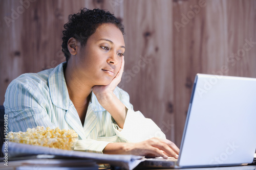 Photo: African businesswoman working in pajamas African businesswoman working in pajamas