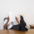 Mixed Race businessman with hole in sock