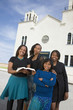 African American woman in front of church