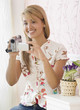 Hispanic woman holding video camera