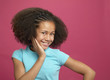 African girl with hand on cheek