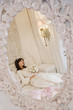 Hispanic girl wearing Quinceanera dress