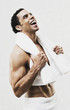 Mixed Race man in towel laughing
