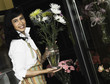 African sales clerk in florist shop