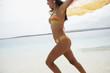 South American woman running on beach