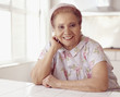 Senior Hispanic woman wearing housecoat