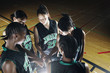 Girls basketball team in huddle