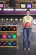 Portrait of woman holding bowling ball