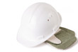 Close-up of hard hat and mittens, isolated over white