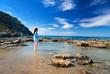 Greece.Rhodes.The young beautiful woman on seacoast