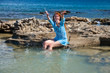 Greece. Rhodes.The young beautiful woman on seacoast