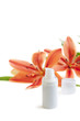 Face cream/lotion with lily flowers, closeup shot, on white Face cream/lotion with lily flowers, closeup shot, on white