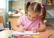 Photo: Cute little girl is drawing with felt-tip pen Cute little girl is drawing with felt-tip pen