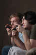 side-view of friends playing video games