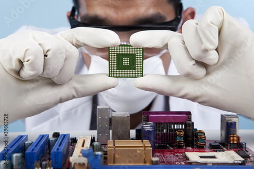 Photo: Checking the computer chip Checking the computer chip
