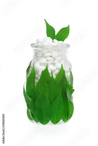 Photo: Herbal supplement pills and leaves – alternative medicine Herbal supplement pills and leaves – alternative medicine