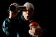 Ghost hunter with a video camcorder and EMF detector.