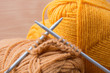knitting needles and skein of acrylic