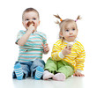 happy children little girl and boy with ice cream in studio isol